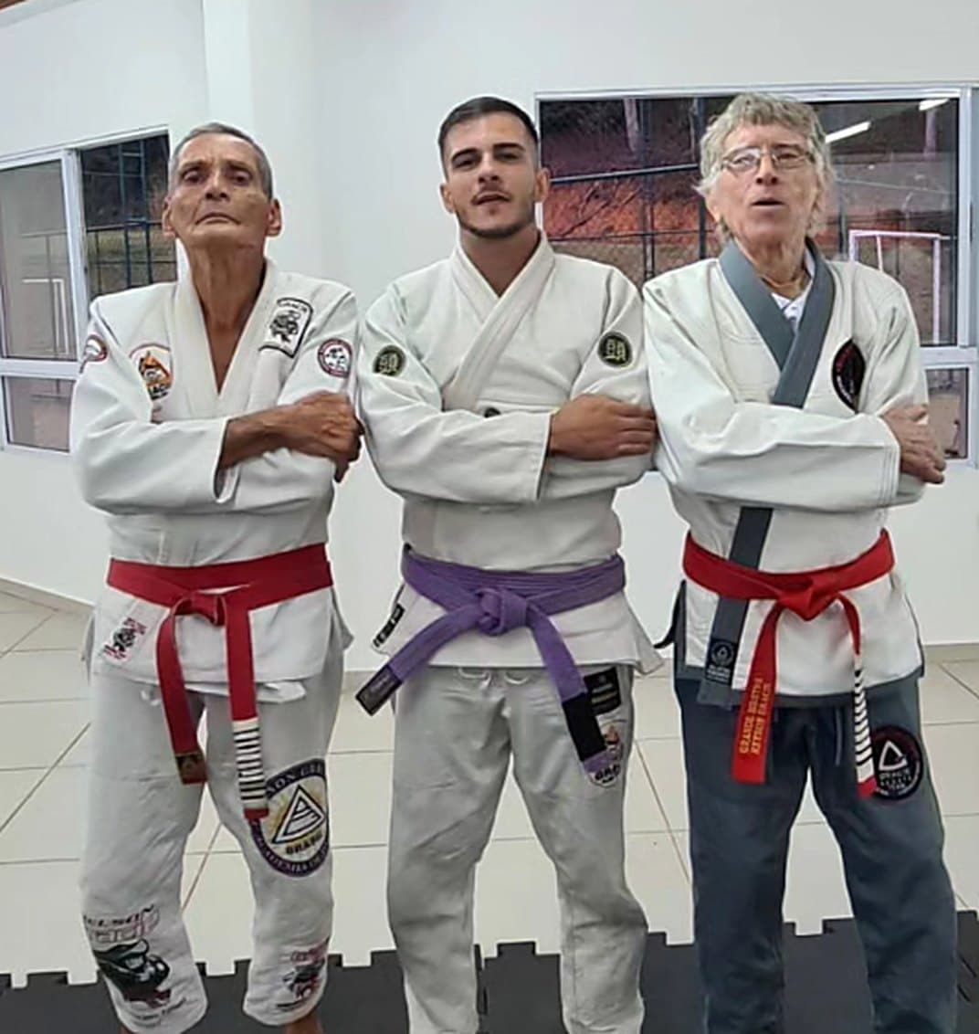 Lucas Percegoni Rocha com os mestres Relson Gracie e Reyson Gracie